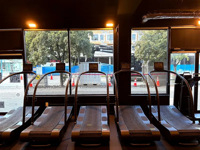 Treadmills in front of the studio windows in Lower Lonsdale